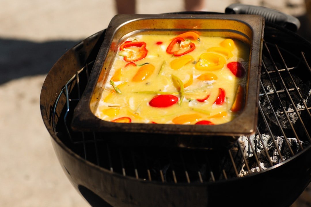 A small bowl of cottage cheese garnished with a sprinkle of black pepper and chives.